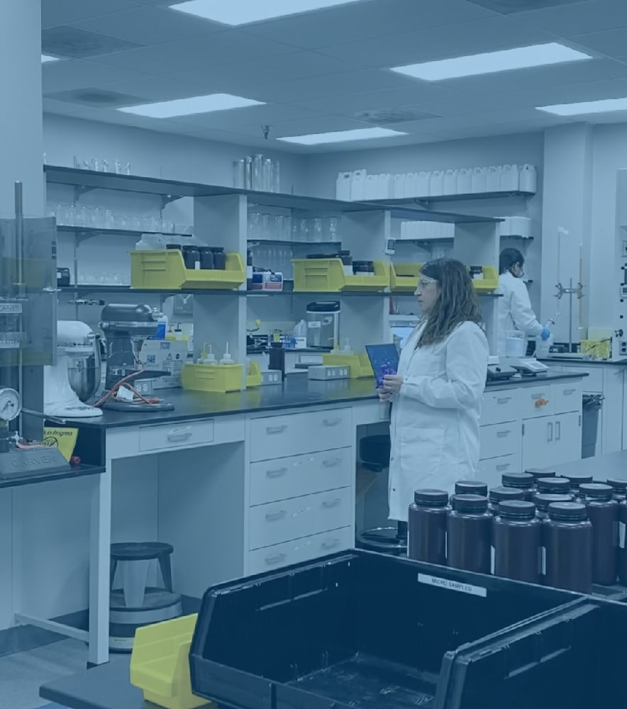 Image of inside of on of Sterilex's labs with two chemists working. Sterilex recently opened new lab space.
