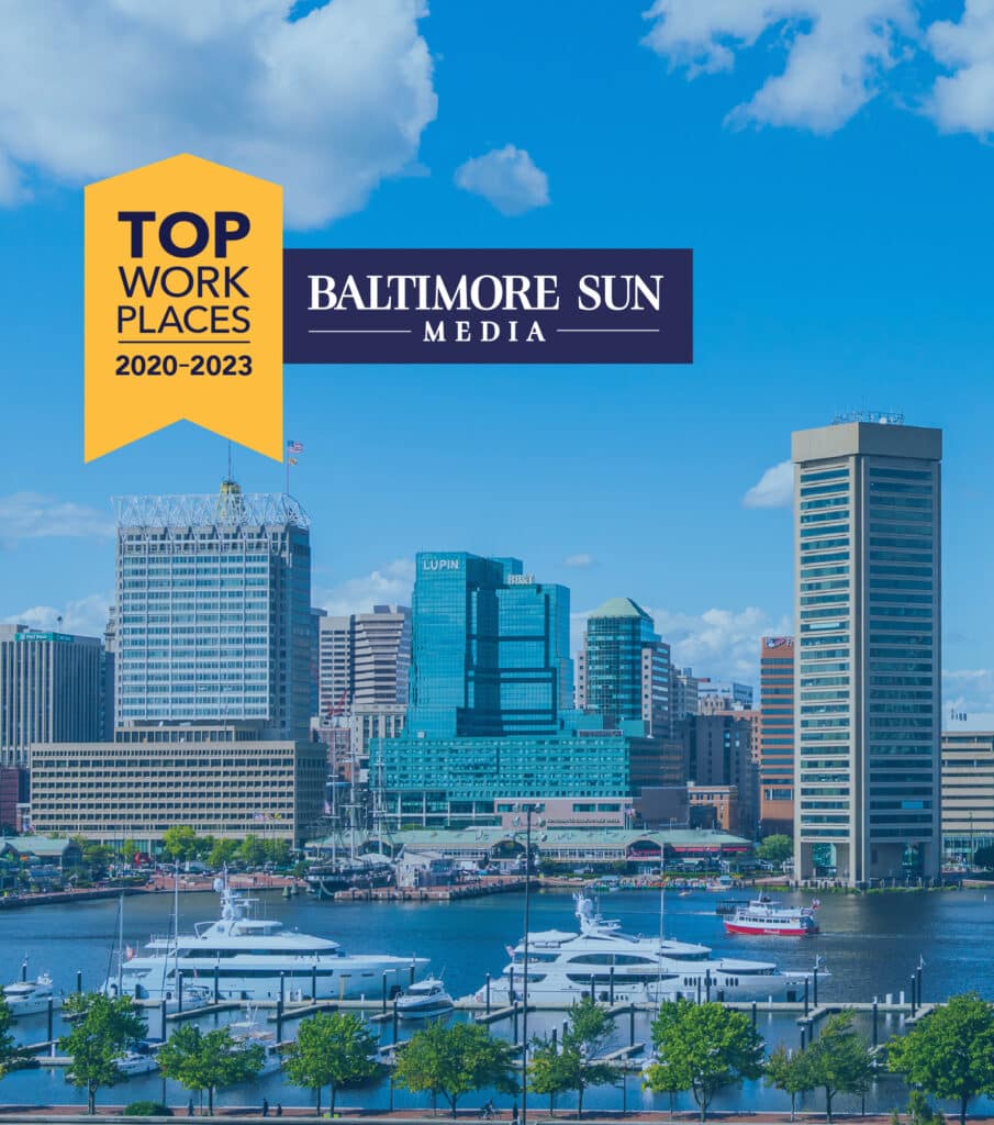 image of the Baltimore inner harbor skyline with boats near the dock, the top workplace 2022-2023, Baltimore Sun Media is in the top portion of the image