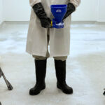 ProvaStride Handheld Spreader being used to spread product on floor
