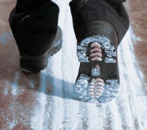 closeup of person's boot walking through sterilex powder