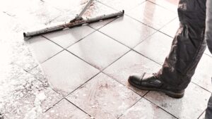 worker mopping foam product on the floor